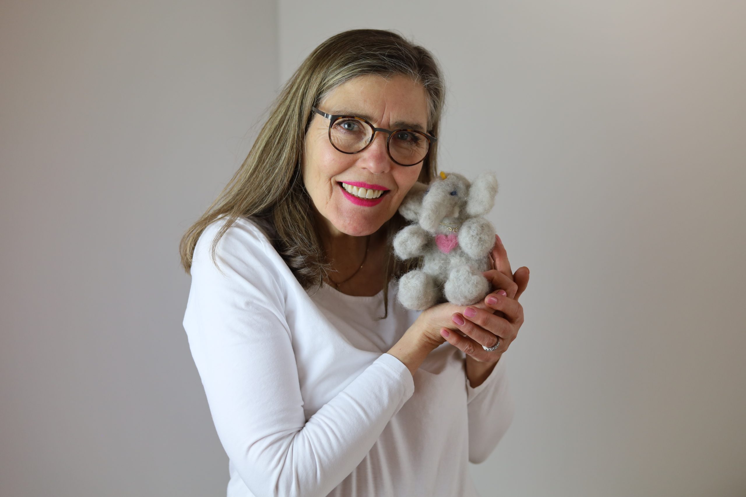 Eva Aminoff with her handmade woolen elephant toy