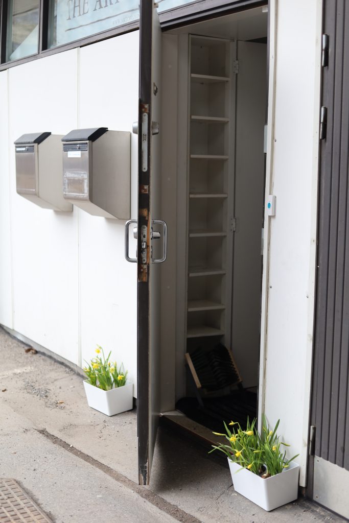 Opening to the studio, flowers in front of the door